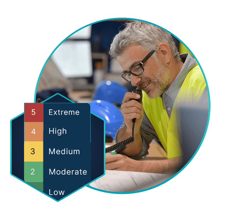 image of risk analyst analysing data and calling a stakeholder